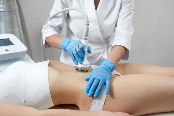 Lost the Weight but Not the Loose Skin? 2 woman having HIFU treatment on her stomach to combat loose skin Southampton following weight loss